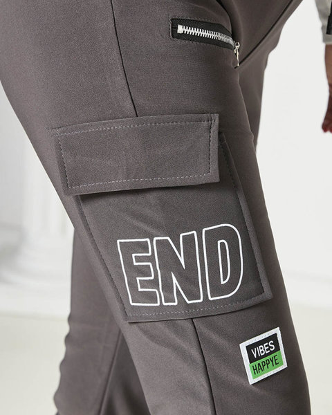 Dámské bojové kalhoty s nápisem v tmavě šedé barvě- Oblečení
