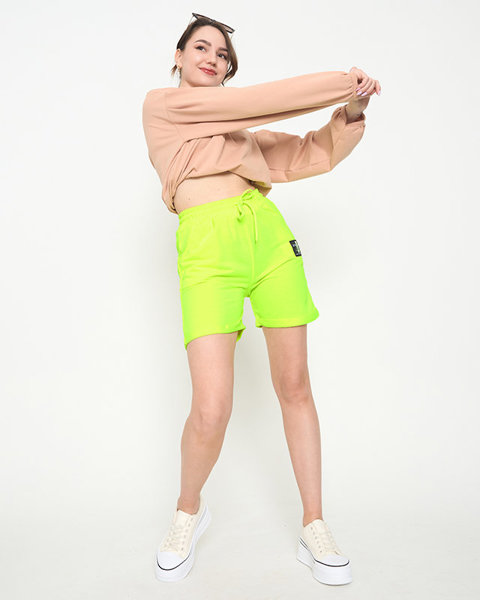 Neonově žluté dámské šortky nad kolena - Oblečení