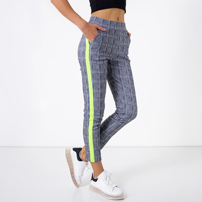 Šedé kostkované treggy s neonově žlutými pruhy - kalhoty