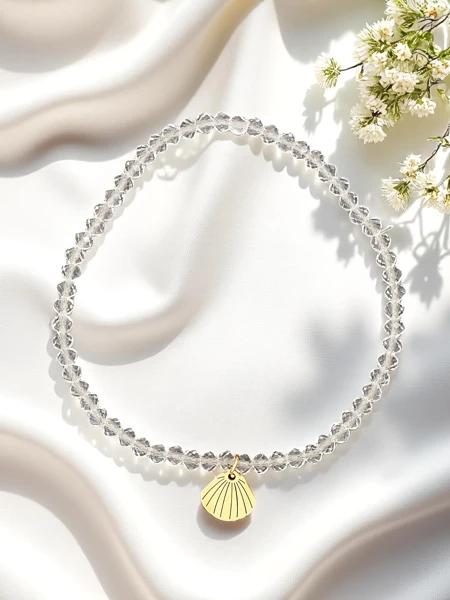 Royalfashion Dámský náramek s přívěskem ve tvaru mušle