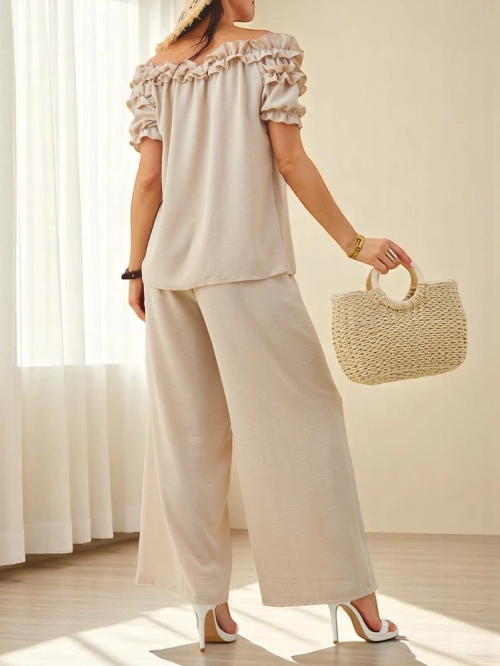 Royalfashion Жіночий комплект з блузою без рукавів з короткими рукавами та декоративним вирізом, а також розкльошеними штанами