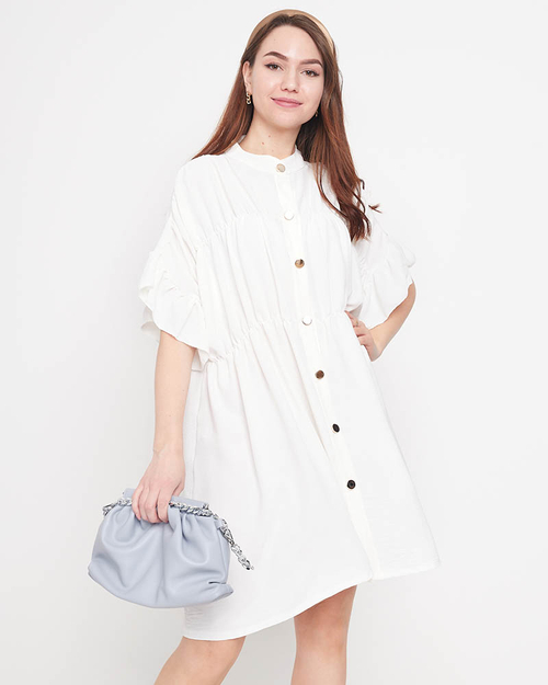 Біла жіноча сукня довжиною до колін