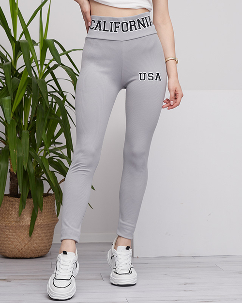 Легінси жіночі світло-сірі в рубчик з написами - Clothing