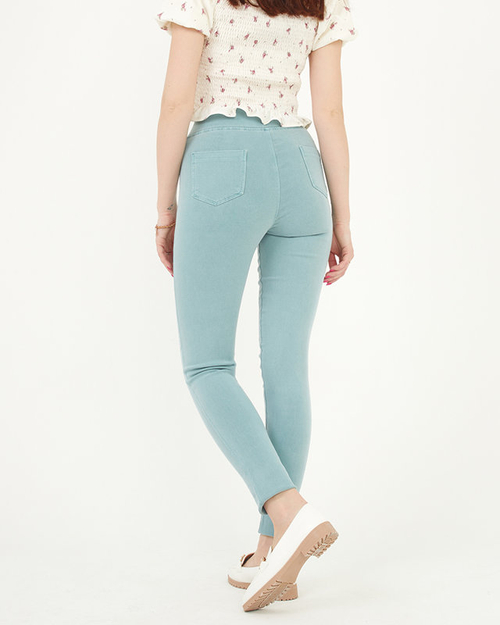 Жіночі штани м'ятно-зеленого кольору з декоративними ґудзиками