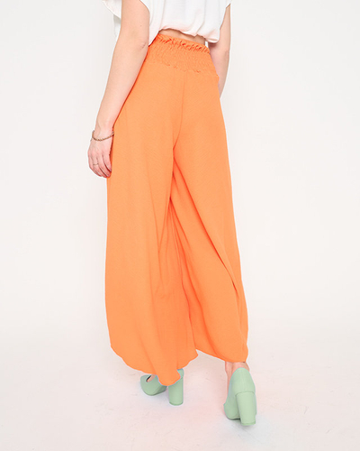 Помаранчеві жіночі штани палаццо довжиною в 7/8
