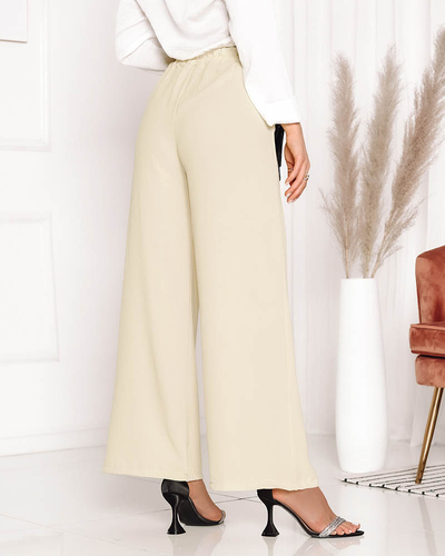 Жіночі широкі жовті штани палаццо з ланцюжком - Одяг
