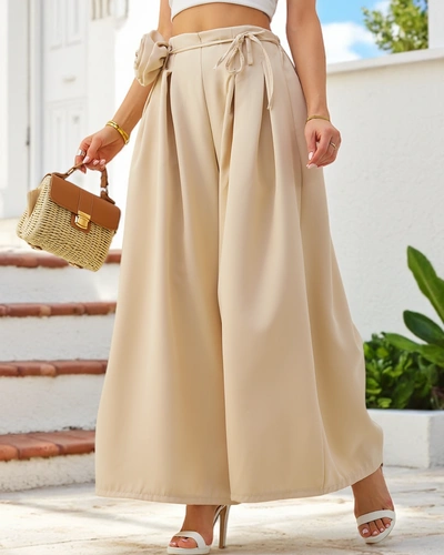 Royalfashion Elegantní široké dámské kalhoty se dekorativním květinovým detailem v pase