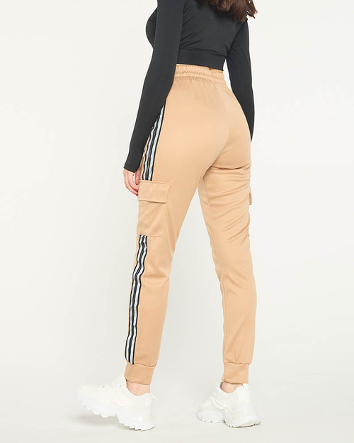 Бежеві жіночі штани з лампасами