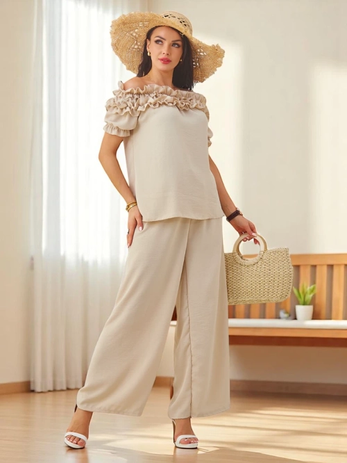 Royalfashion Жіночий комплект з блузою без рукавів з короткими рукавами та декоративним вирізом, а також розкльошеними штанами