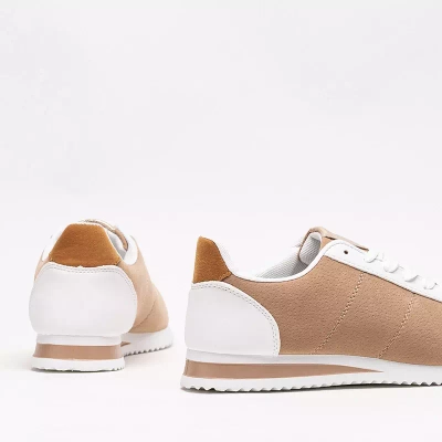 OUTLET Béžová dámská sportovní obuv na ploché podrážce Soruti - Obuv