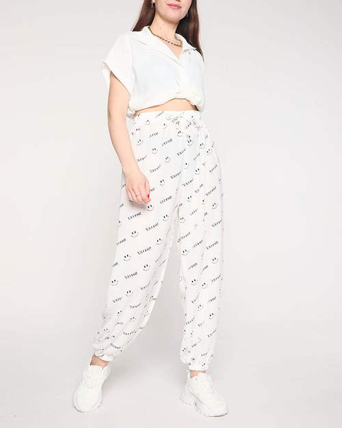 Білі жіночі штани з принтом