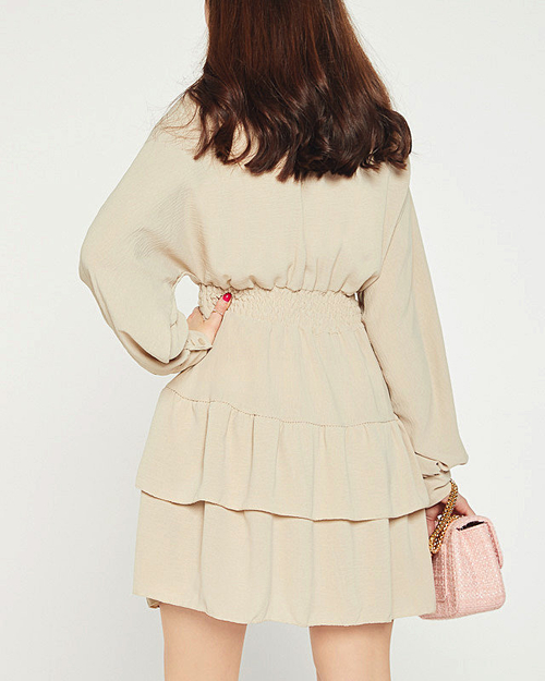 Бежева сукня з оборками