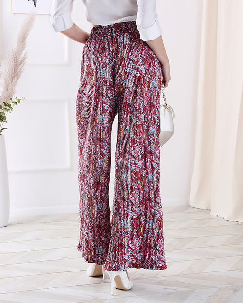 Жіночі брюки з візерунком на широких штанинах червоного кольору - Одяг