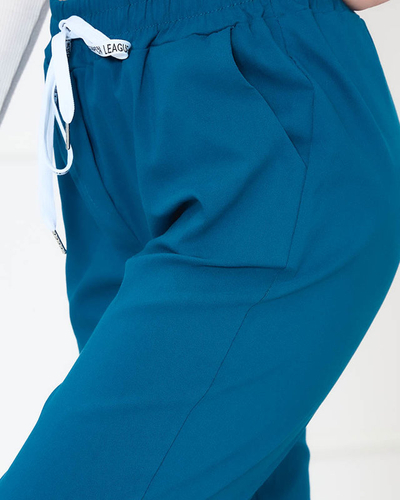 Жіночі тканинні штани бірюзового кольору - Одяг