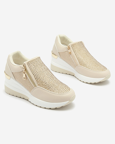 Бежеві жіночі спортивні туфлі на платформі з цирконами Martela - Взуття