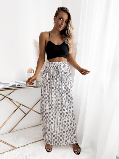Біла жіноча плісирована спідниця максі з візерунками - Одяг