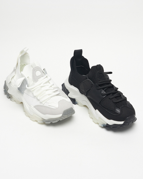 Біле жіноче спортивне взуття на масивній підошві Tiroka - Взуття