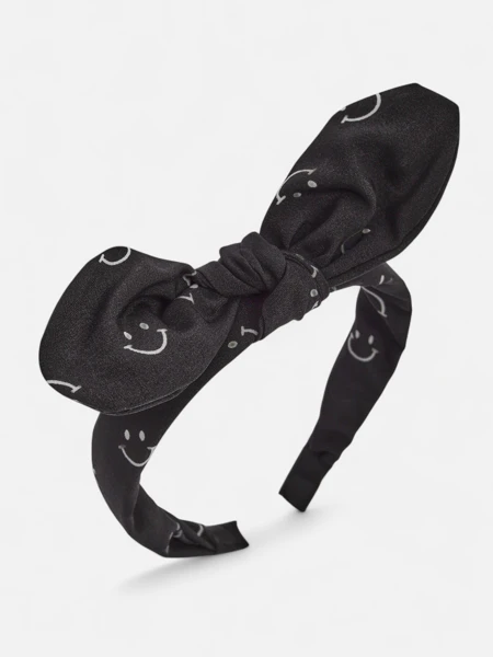 Royalfashion Dětská čelenka do vlasů s mašlí s potiskem usměvavých obličejů