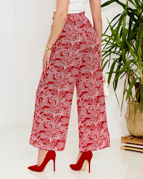 Червоні жіночі тканинні штани з принтом - Одяг