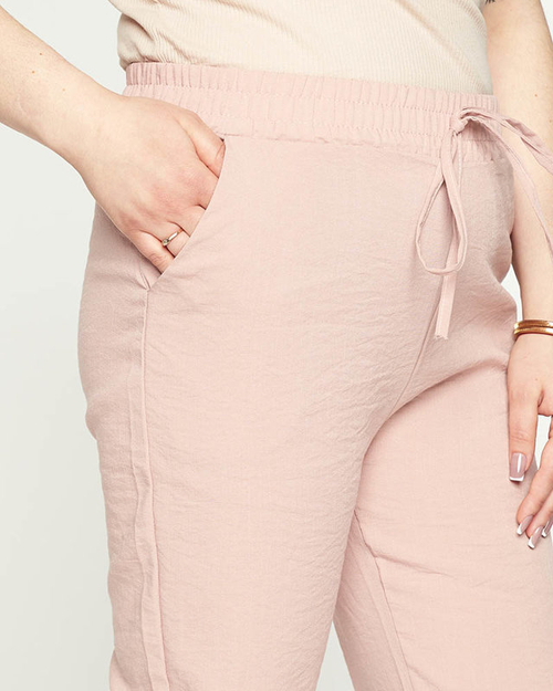 Жіночі джоггери з рожевої тканини PLUS SIZE - Одяг
