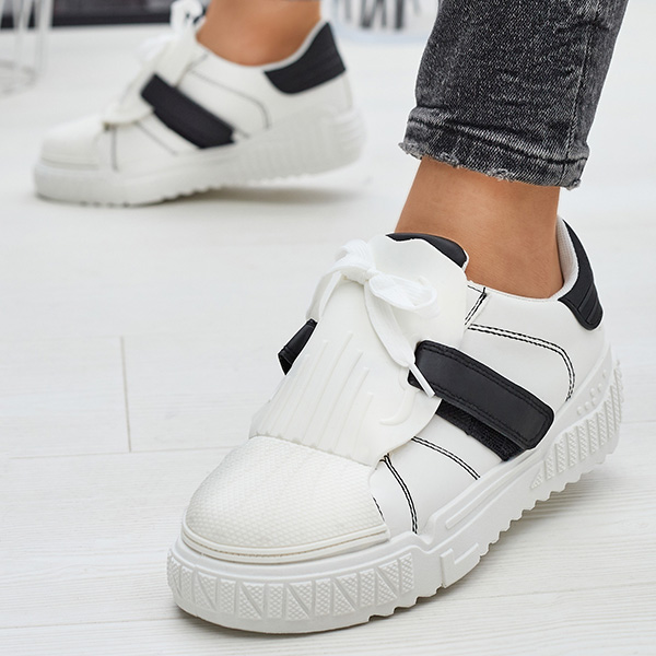 Чорно-білі жіночі спортивні кросівки з гумовими вставками Inika - Взуття