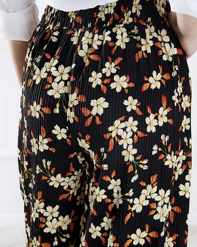 Жіночі чорні штани з квіткової тканини - Одяг