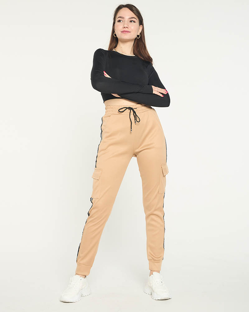 Бежеві жіночі штани з лампасами