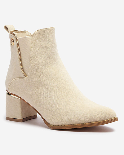 Жіночі ботильйони на низькій шпильці кольору екрю Xizia - Взуття