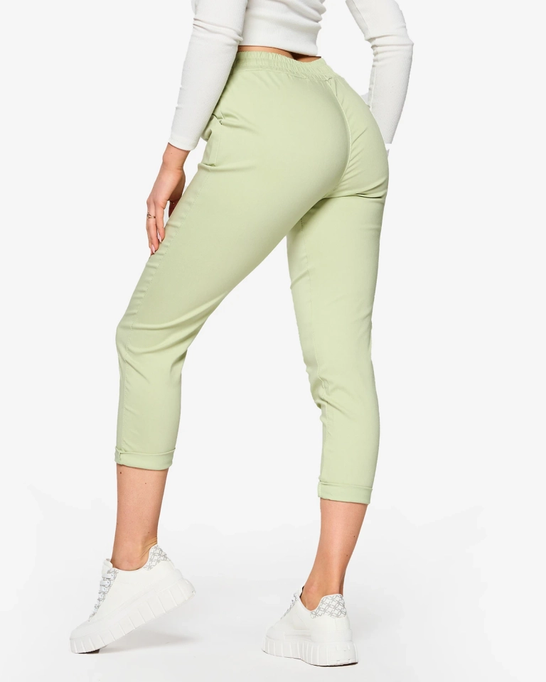 Dámské látkové kalhoty v mátové barvě- Oblečení