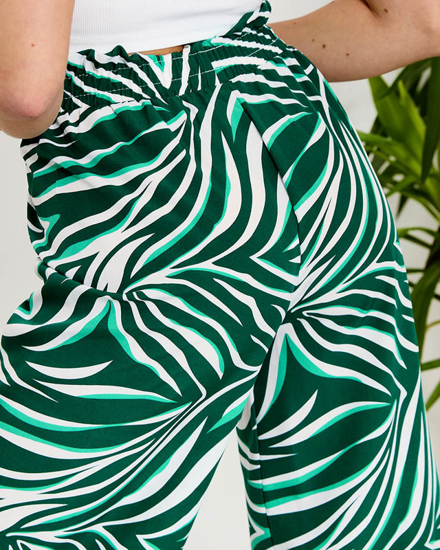 Vzorované dámské palazzo kalhoty v zelené barvě- Oblečení