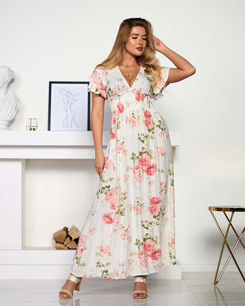 Біла жіноча сукня з квітковим принтом