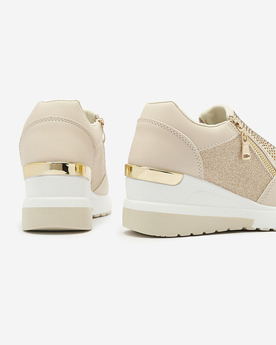 Бежеві жіночі спортивні туфлі на платформі з цирконами Martela - Взуття