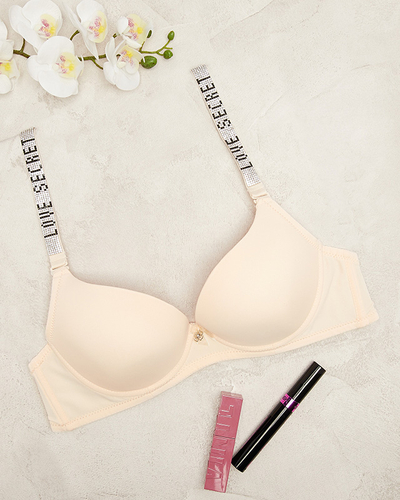 Гладкий бежевий бюстгальтер пуш-ап з декорованими бретелями - Нижня білизна