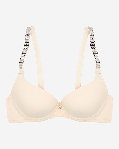 Гладкий бежевий бюстгальтер пуш-ап з декорованими бретелями - Нижня білизна