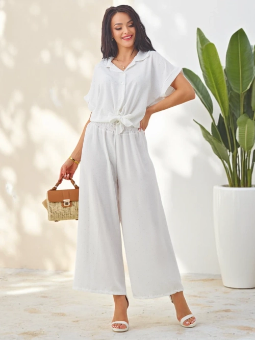 Royalfashion Жіночий комплект з зав'язаною сорочкою з коротким рукавом і розкльошеними штанами з стразами