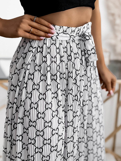 Біла жіноча плісирована спідниця максі з візерунками - Одяг