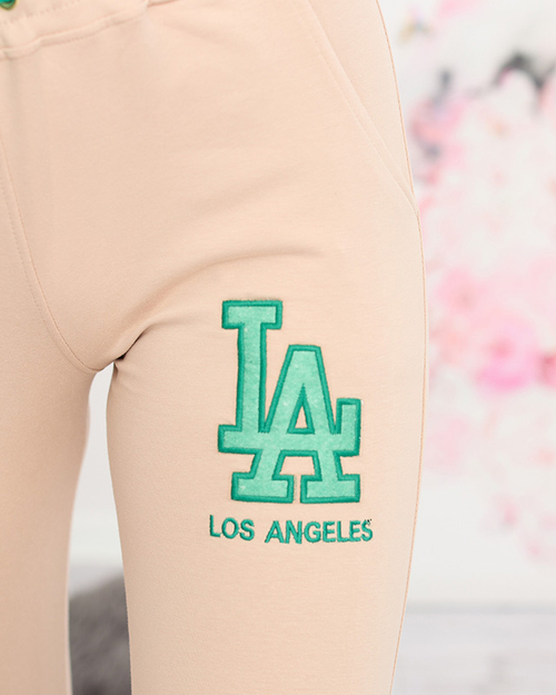 Жіночі бежеві спортивні штани з кольоровою нашивкою - Одяг