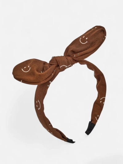 Royalfashion Dětská čelenka do vlasů s mašlí s potiskem usměvavých obličejů