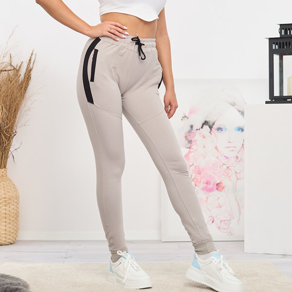 Dámské světle šedé tepláky s vsadkami- Oblečení