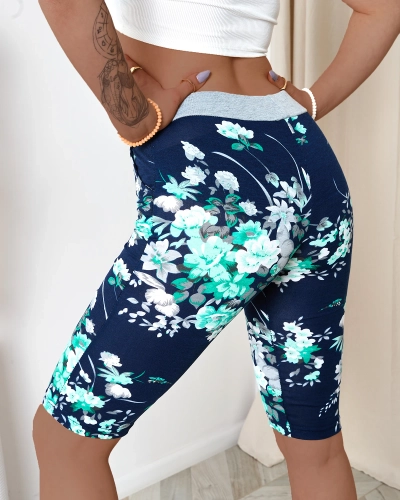 Dámské 3/4 tmavě modré kraťasy se zelenými květy PLUS SIZE - Oblečení