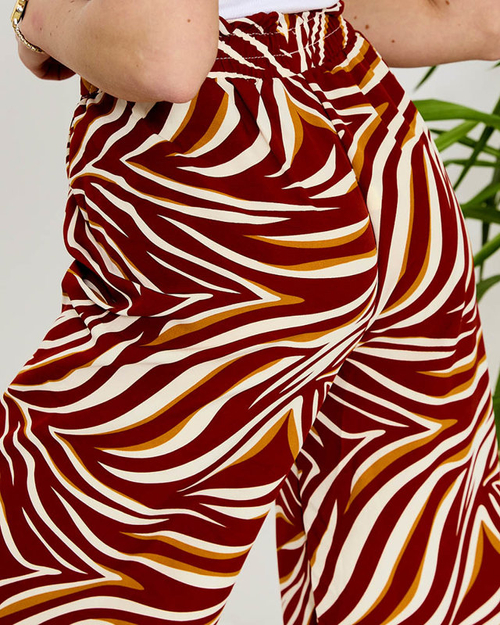 Візерункові жіночі штани палаццо червоного кольору - Одяг