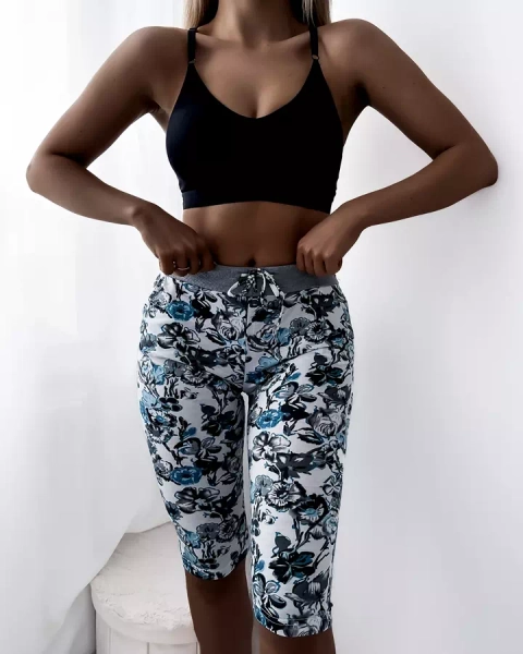 Vzorované dámské 3/4 šortky tyrkysově bílé PLUS VELIKOST - Oblečení