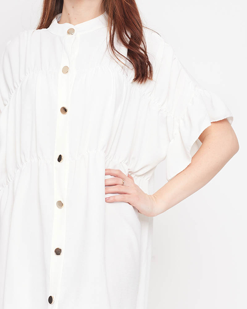 Біла жіноча сукня довжиною до колін