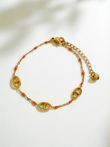 Aurelia Perseus - елегантний позолочений браслет з геометричним мотивом