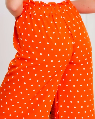 Жіночі широкі брюки в помаранчевий горох - Одяг