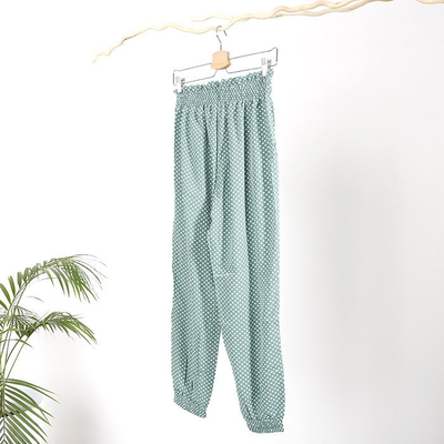 Dámské zelené puntíkové kalhoty PLUS SIZE - Oblečení