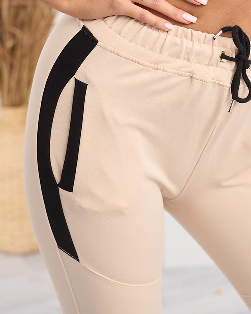 Жіночі бежеві спортивні штани зі вставками- Одяг