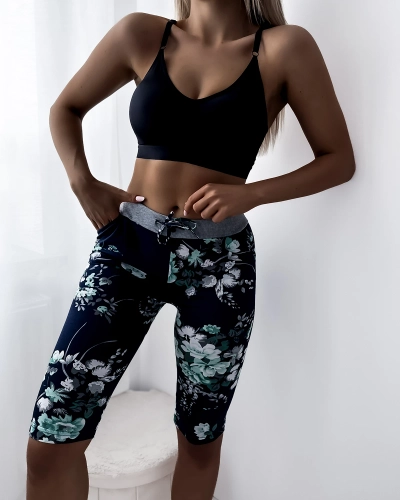 Dámské 3/4 tmavě modré kraťasy se zelenými květy PLUS SIZE - Oblečení