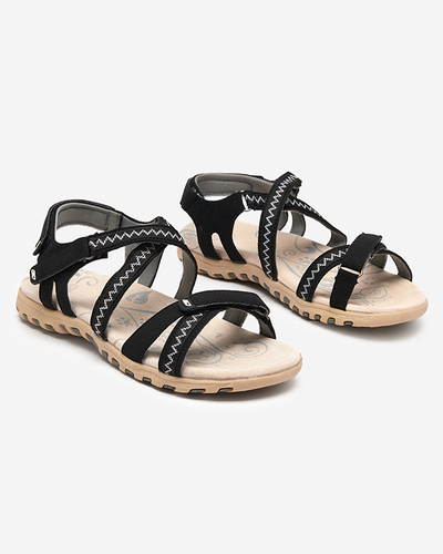 Černé dámské sandály na ploché podrážce Koralli. Obuv