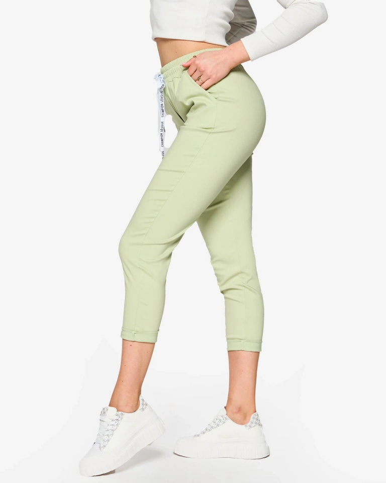 Dámské látkové kalhoty v mátové barvě- Oblečení